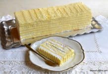 Tort de bezea cu cremă de lămâie și cremă de portocale Tort de bezea cu cremă de lămâie și portocale rețeta savori urbane